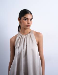 Model wearing Bubble hem mini dress in oyster satin twill
