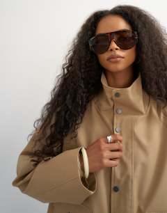 Model wearing Bubble hem trench in stone
