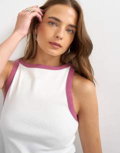 Model wearing Burgundy tipping slash neck racer vest in ecru