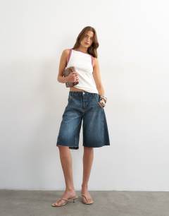 Model wearing Burgundy tipping slash neck racer vest in ecru