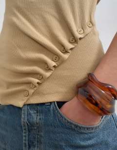 Model wearing Button detail slash neck ribbed top in oat
