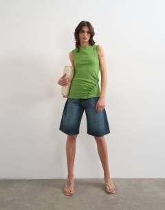 Model wearing Button detail slash neck ribbed top in olive green