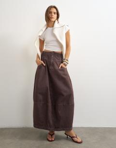 Model wearing Button front barrel maxi skirt in chocolate