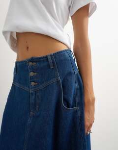 Model wearing Button front barrel maxi skirt in indigo