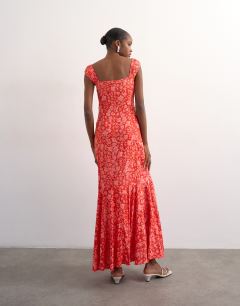 Model wearing Button front cap sleeve maxi sundress in red ditsy floral