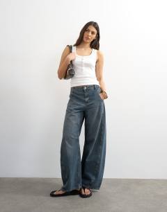 Model wearing Button rib vest in white