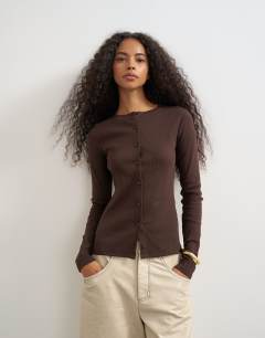 Model wearing Button through long sleeve top in chocolate