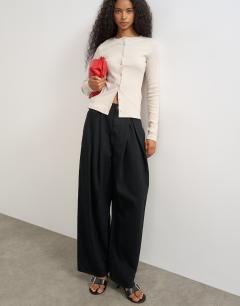 Model wearing Button through long sleeve top in oat