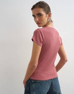 Model wearing Button through short sleeve top in berry