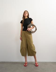 Model wearing Button through short sleeve top in black