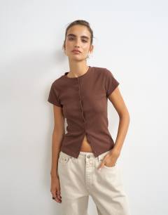 Model wearing Button through short sleeve top in brown