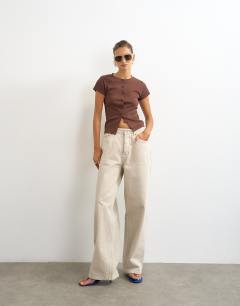 Model wearing Button through short sleeve top in brown