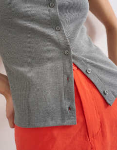 Model wearing Button through short sleeve top in dark grey