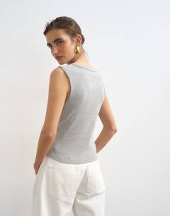 Model wearing Button through vest in grey marl