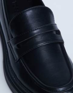 Model wearing Cade chunky sole loafer in black