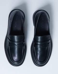 Model wearing Cade chunky sole loafer in black