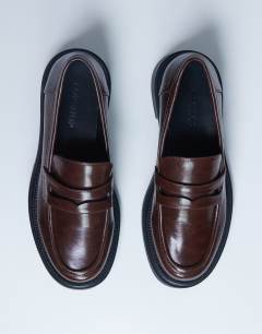 Model wearing Cade chunky sole loafer in chocolate
