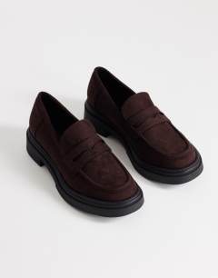 Model wearing Cade faux suede chunky sole loafer in chocolate