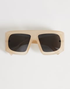 Model wearing Cairo chunky square sunglasses in off white