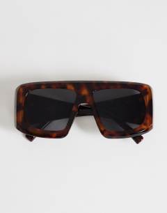 Model wearing Cairo chunky square sunglasses in tortoise shell