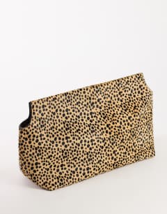 Model wearing Cam oversized hair on real leather clutch bag in leopard print
