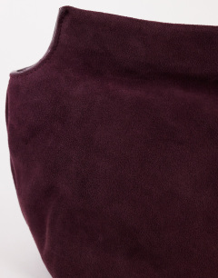Model wearing Cam oversized real leather clutch bag in plum