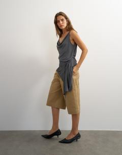 Model wearing Cami asymmetric top in black