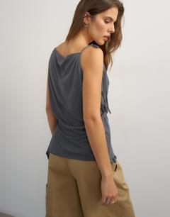 Model wearing Cami asymmetric top in black