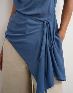 Model wearing Cami asymmetric top in dark blue