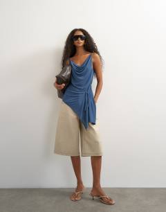 Model wearing Cami asymmetric top in dark blue