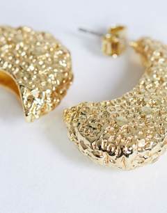 Model wearing Camille textured stud earring in gold tone