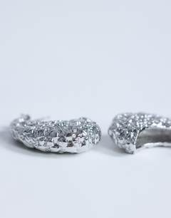 Model wearing Camille textured stud earring in silver tone