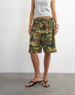 Model wearing Camouflage washed long line tie detail shorts in khaki