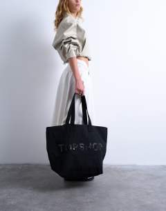 Model wearing Canvas tote bag in black