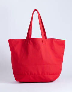 Model wearing Canvas tote bag in red