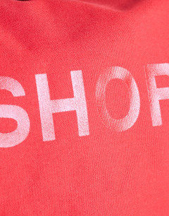 Model wearing Canvas tote bag in red