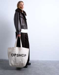 Model wearing Canvas tote bag in white