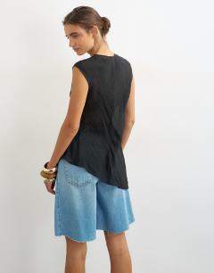 Model wearing Cap sleeve asymmetric tie detail top in black