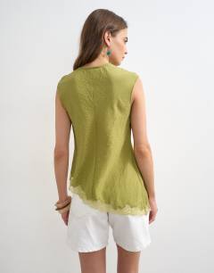 Model wearing Cap sleeve asymmetric tie front lace detail top in khaki