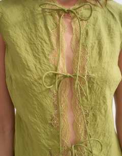 Model wearing Cap sleeve asymmetric tie front lace detail top in khaki