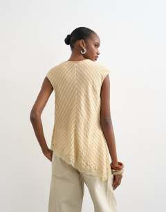 Model wearing Cap sleeve asymmetric tie front lace detail top in yellow stripe 