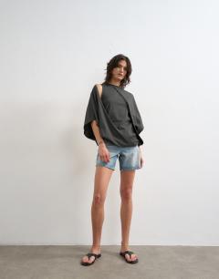 Model wearing Cape draped tee in charcoal