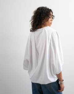 Model wearing Cape draped tee in white