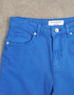 Model wearing Capri comfort stretch jean in cobalt