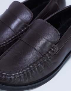 Model wearing Carey real leather loafer with ruched detail in chocolate brown