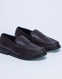 Model wearing Carey real leather loafer with ruched detail in chocolate brown