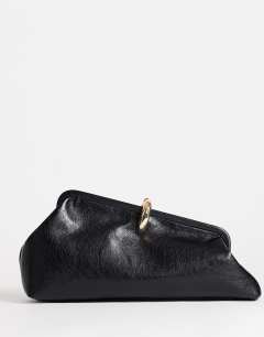 Model wearing Carlie clutch with hardware in black