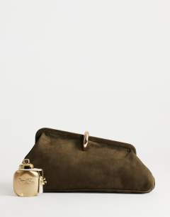 Model wearing Carlie medium clutch with hardware in khaki