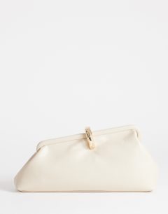 Model wearing Carlie medium clutch with hardware in stone