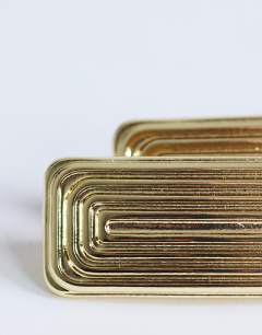 Model wearing Carmen rectangle stud earring in gold tone